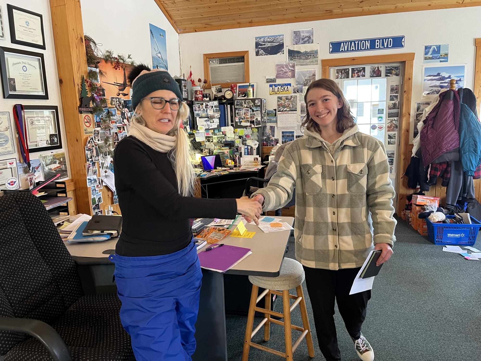 Anna Chase, EAA Chapter 54's Ray Scholar, is congratulated after passing her checkride  January 26, 2025.