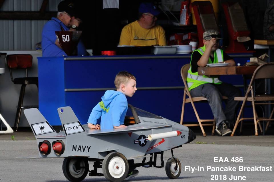 EAA486 Fly-in Breakfast boy in toy airplane
