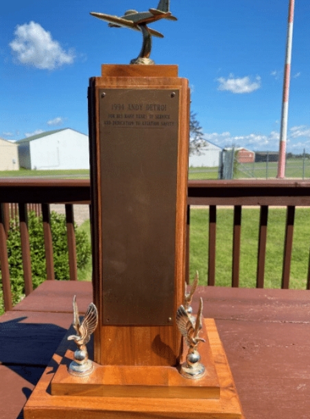 A trophy sits on the picnic table at Lake Elmo Airport. It's the lifetime achievement award