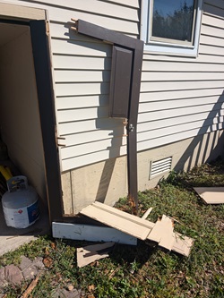 The old, rotted storage area doors were destroyed in a windstorm in early September 2024