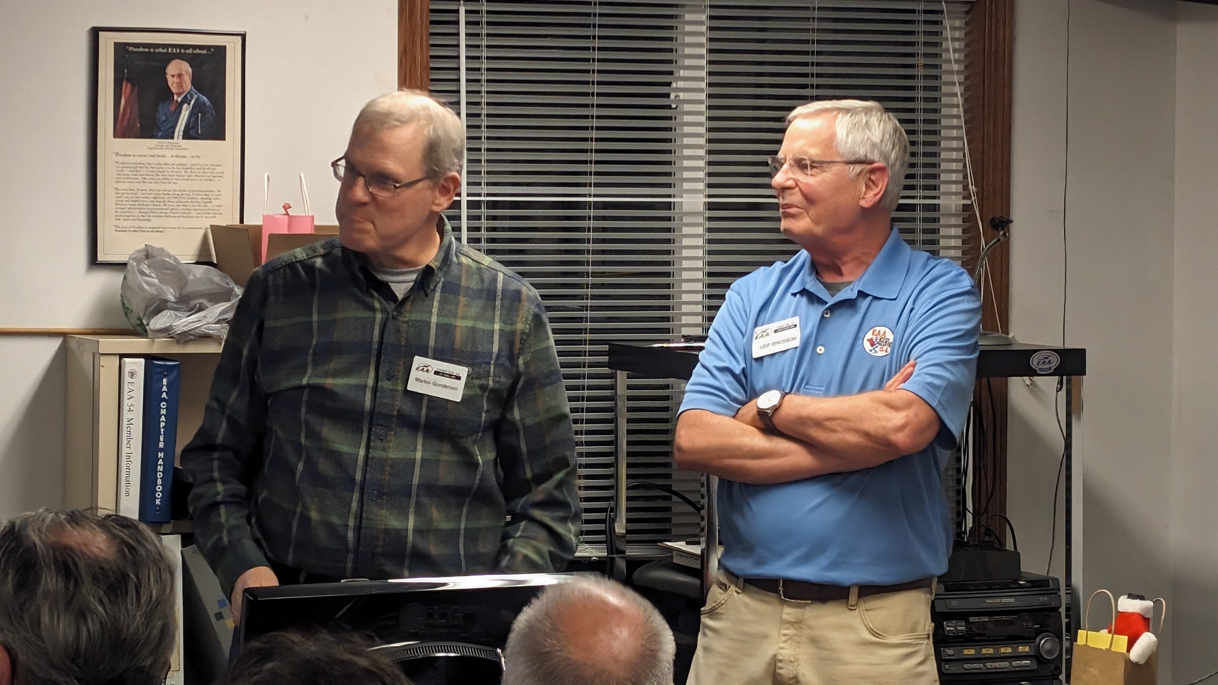 Incoming president Marlon Gunderson and his predecessor, Leif Erickson, prepare to end a chapter meeting on November 13, 2023.