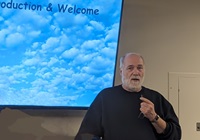 Brad Cornell, an airport noise activist, speaks to the chapter