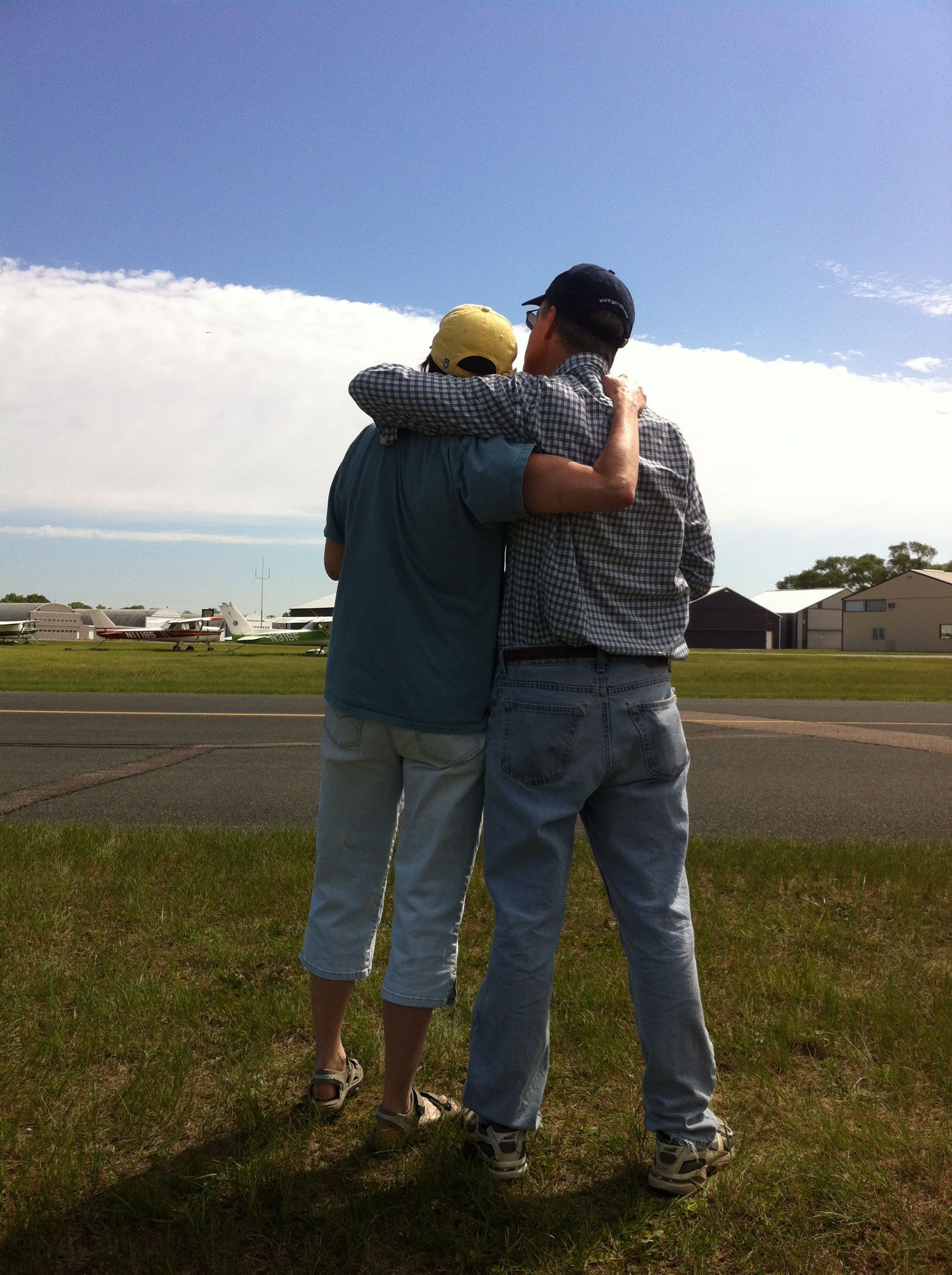 Bob and Carolie Collins watch the first flight of their RV-7A in June 2012