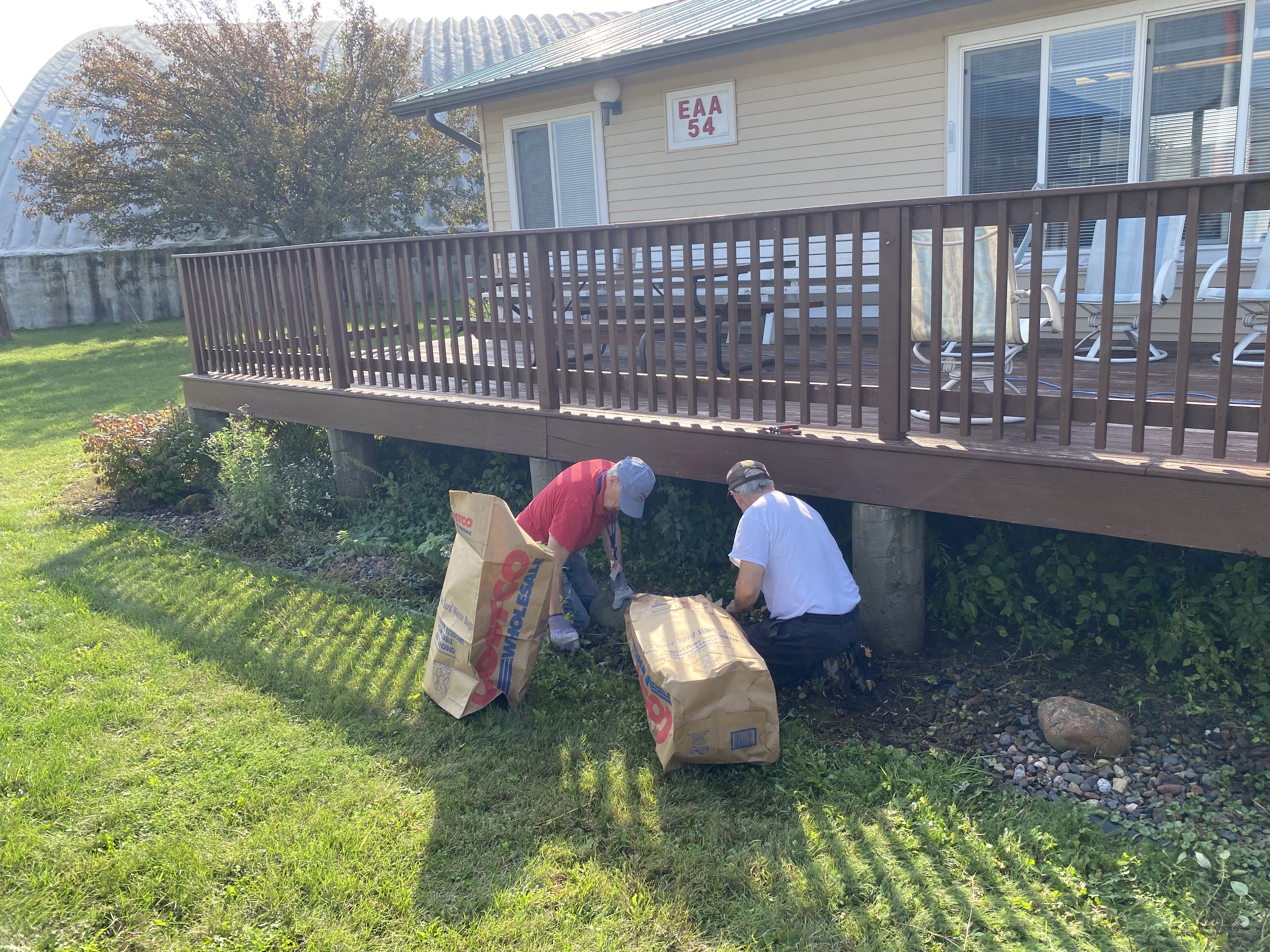 EAA 54 members volunteered to clean up the landscaping around the clubhouse foundations on September 30, 2023.