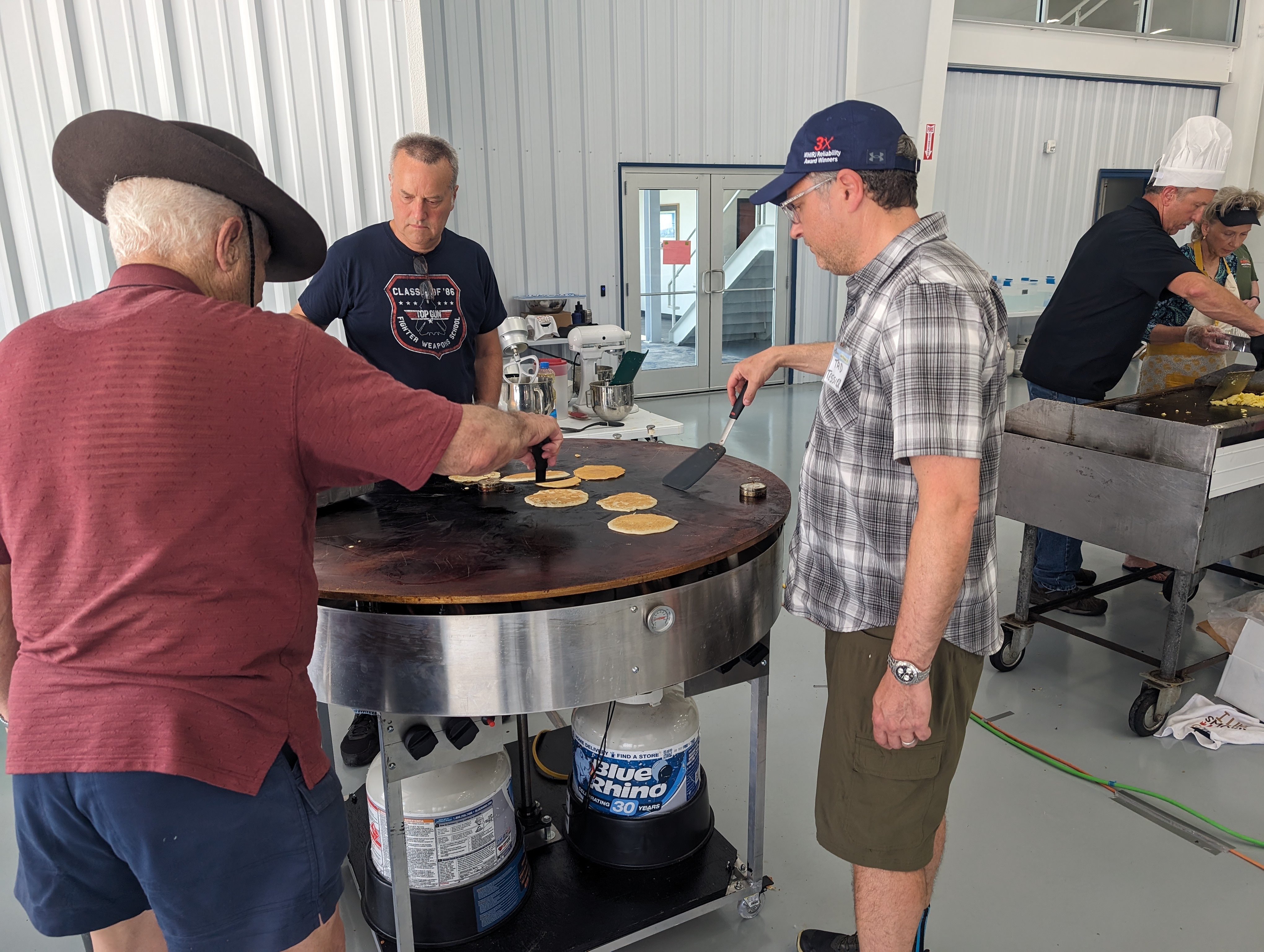 Members of Chapter 25 work their new grill at a pancake breakfast on June 16, 2024.